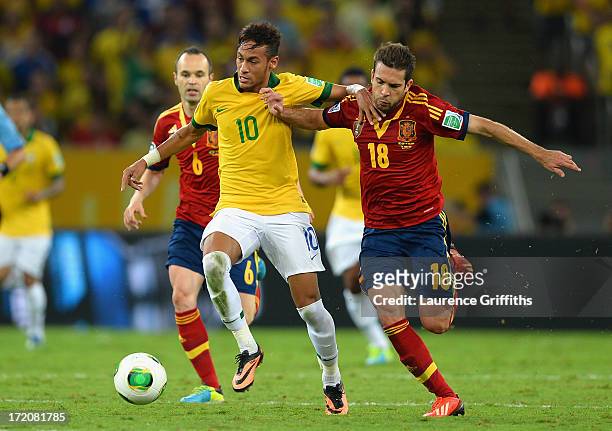 Neymar of Brazil competes with Jordi Alba of Spain during the FIFA Confederations Cup Brazil 2013 Final match between Brazil and Spain at Maracana on...