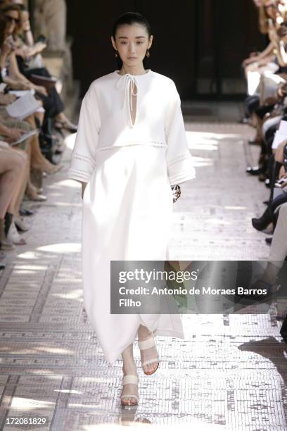 Model walks the runway during Christophe Josse show as part of Paris Fashion Week Haute-Couture Fall/Winter 2013-2014 at les Beaux Arts on July 1,...