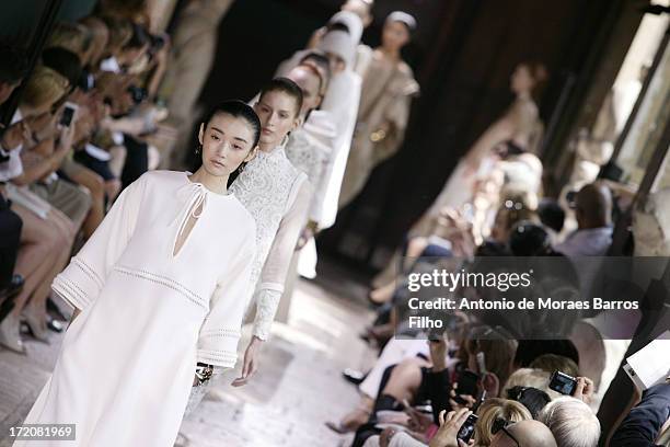 Model walks the runway during Christophe Josse show as part of Paris Fashion Week Haute-Couture Fall/Winter 2013-2014 at les Beaux Arts on July 1,...