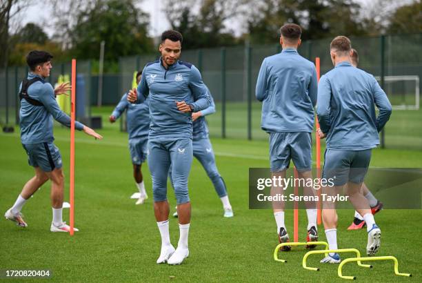 Jacob Murphy warms up during the Newcastle United Training Session at the Newcastle United Training Centre on October 06, 2023 in Newcastle upon...