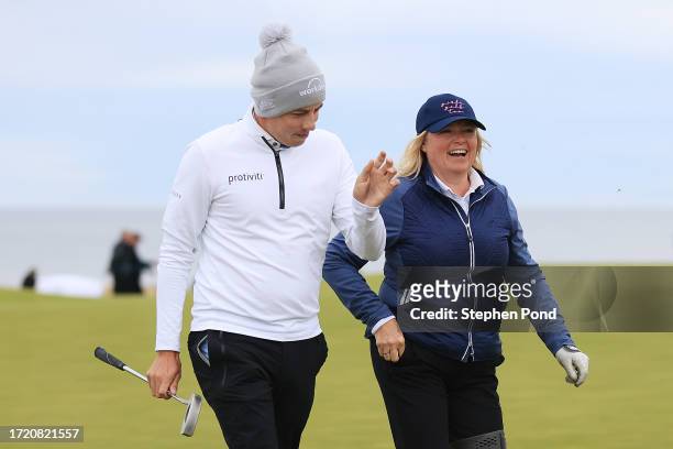 Matt Fitzpatrick of England walks with his Mother and playing partner, Susan Fitzpatrick during Day Two of the Alfred Dunhill Links Championship at...