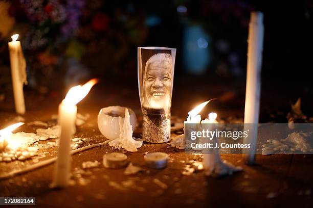 Memorial of candles and a photo of Former South African President Nelson Mandela sits outside the Mediclinic Heart Hospital where Mandela is being...