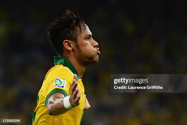 Neymar of Brazil celebrates as he scores their second goal during the FIFA Confederations Cup Brazil 2013 Final match between Brazil and Spain at...