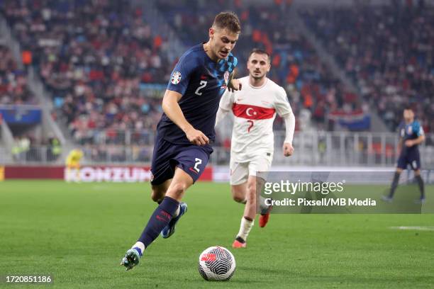 Josip Stanisic of Croatia runs with the ball during the UEFA EURO 2024 European qualifier match between Croatia and Türkiye at Opus Arena on October...