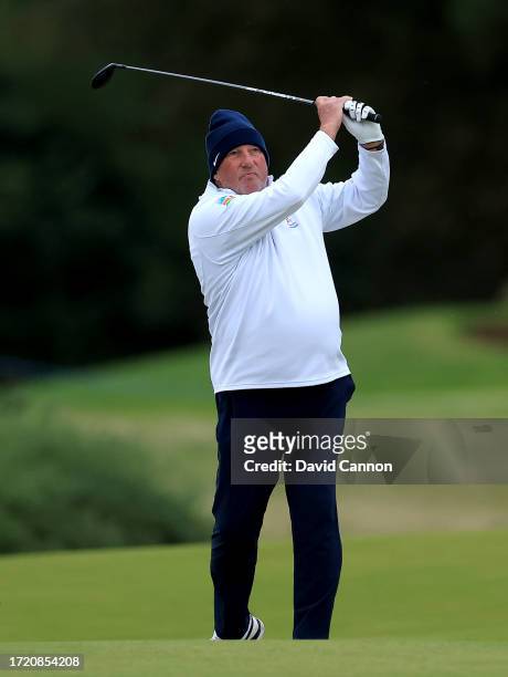 Sir Ian Botham of England the former cricketer plays his second shot on the ninth hole during Day Two of the Alfred Dunhill Links Championship on the...
