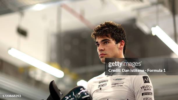 17th placed qualifier Lance Stroll of Canada and Aston Martin F1 Team looks on in the FIA garage during qualifying ahead of the F1 Grand Prix of...