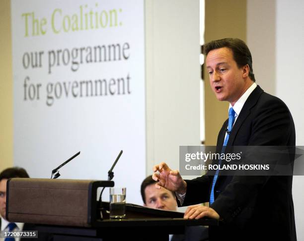 British Prime Minister David Cameron gives a speech at the launch of the Government Programme Coalition Agreement document in central London on May...