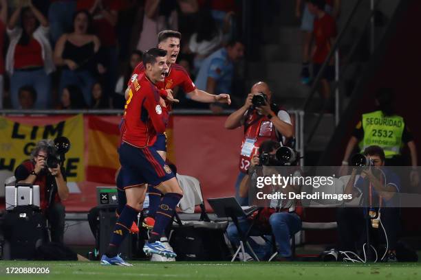 Alvaro Morata of Spain celebrates after scoring his team's first goal with teammates during the UEFA EURO 2024 European qualifier match between Spain...