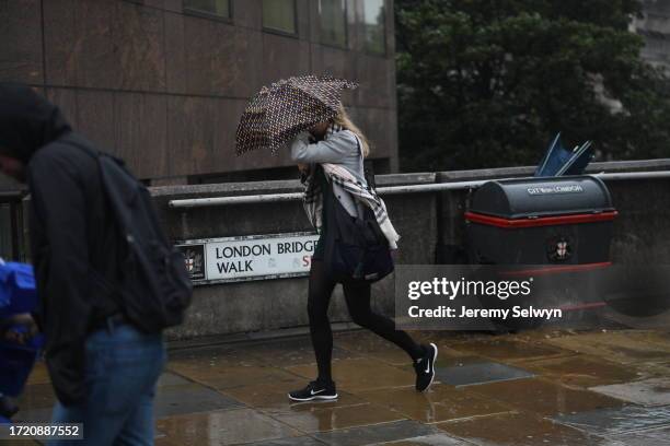 London Bridge Terror Attack..Rain Storm Hits Commuters On London Bridge As They Battle Against The Rain And New Anti Terrorist Barriers. 06-June-2017