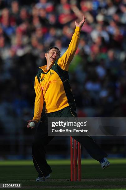 Notts bowler David Hussey in action during the Friends Life T20 match between Lancashire Lightning and Nottinghamshire Outlaws at Old Trafford on...