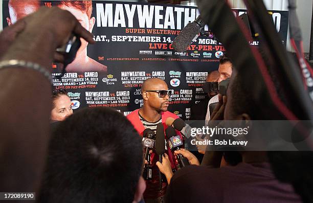 Floyd Mayweather talks with the media after a press conference discussing his upcoming championship fight with Canelo Alvarez July 1, 2013 at Union...