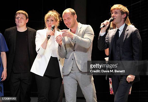 James Christy, Mel Giedroyc, Jude Law and Luke Treadaway speak on stage at 'A Curious Night at the Theatre', a charity gala evening to raise funds...