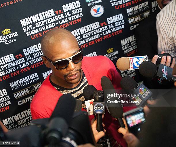 Floyd Mayweather talks with the media after a press conference discussing his upcoming championship fight with Canelo Alvarez July 1, 2013 at Union...