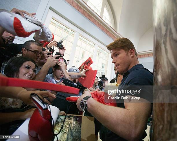 Canelo Alvarez signs autographs after a press conference July 1, 2013 at Union Station at Minute Maid Park in Houston, Texas. Floyd Mayweather and...