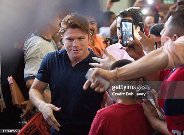 Canelo Alvarez speaks during a press conference to discuss his Super Welterweight World Championship fight with Floyd Mayweather July 1, 2013 at...