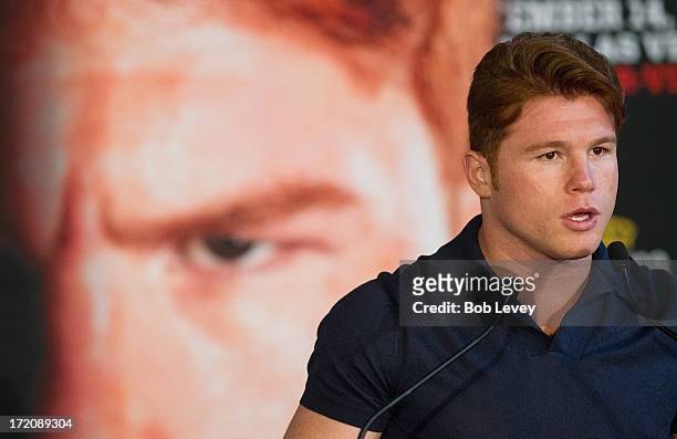 Canelo Alvarez speaks during a press conference to discuss his Super Welterweight World Championship fight with Floyd Mayweather July 1, 2013 at...