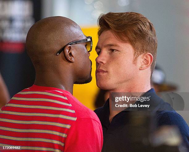 Floyd Mayweather and Canelo Alvarez square off during a press conference to discuss their Super Welterweight World Championship July 1, 2013 at Union...