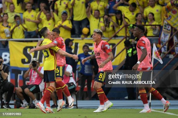 Colombia's midfielder Matheus Uribe celebrates with teammates after scoring his team's second goal during the 2026 FIFA World Cup South American...