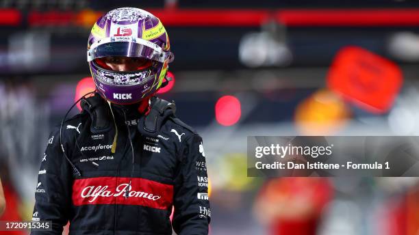 20th placed qualifier Zhou Guanyu of China and Alfa Romeo F1 walks in the Pitlane during qualifying ahead of the F1 Grand Prix of Qatar at Lusail...