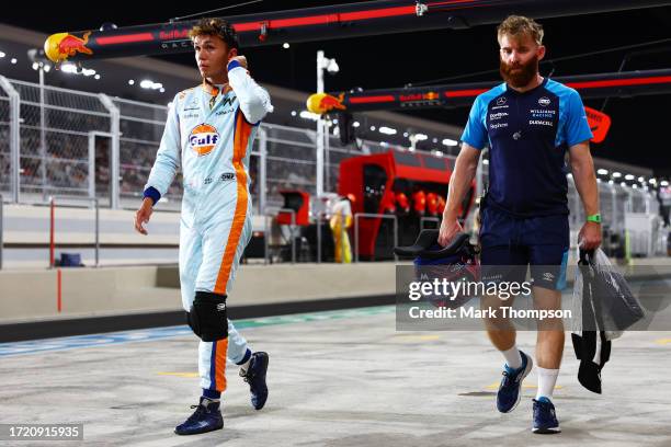 14th placed qualifier Alexander Albon of Thailand and Williams walks in the Pitlane during qualifying ahead of the F1 Grand Prix of Qatar at Lusail...