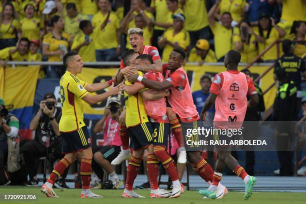 Colombia's midfielder Matheus Uribe celebrates with teammates after scoring his team's second goal during the 2026 FIFA World Cup South American...