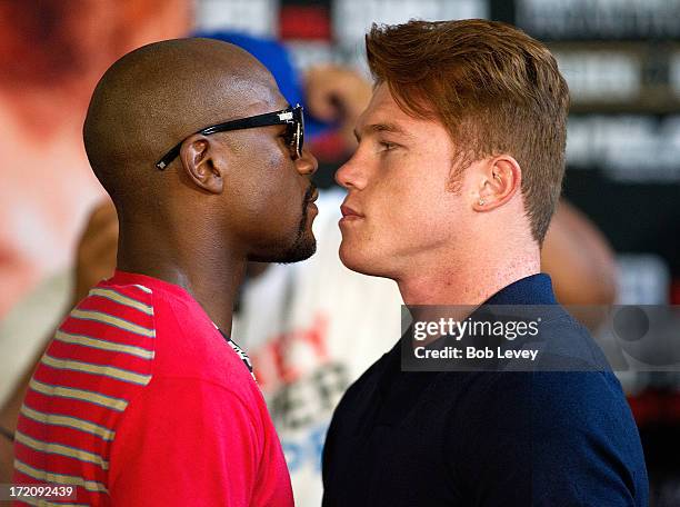 Floyd Mayweather and Canelo Alvarez square off during a press conference to discuss their Super Welterweight World Championship July 1, 2013 at Union...