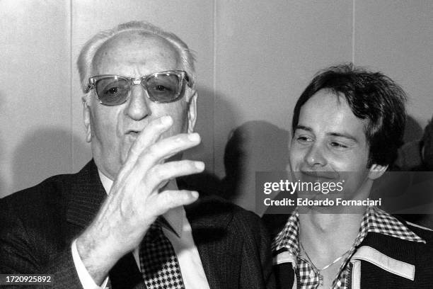 View of Ferrari auto manufacturing founder Enzo Ferrari and Canadian Formula 1 driver Gilles Villeneuve during the unveiling of Ferrari's new 312 T3...