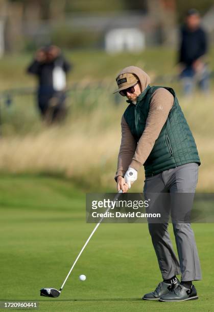 Dave Farrell of The United States of The rock band Linkin Park plays his tee shot on the second hole during Day Two of the Alfred Dunhill Links...