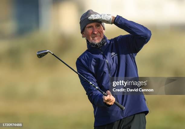 Mike Rutherford of England a member of the British rock group Genesis plays his second shot on the second hole during Day Two of the Alfred Dunhill...