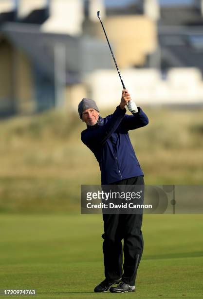 Mike Rutherford of England a member of the British rock group Genesis plays his second shot on the second hole during Day Two of the Alfred Dunhill...