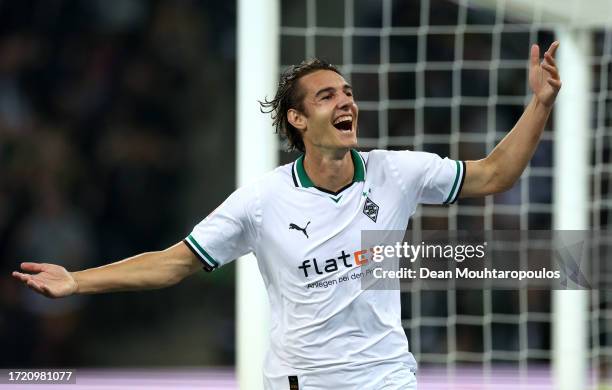 Florian Neuhaus of Borussia Moenchengladbach celebrates after scoring the team's first goal during the Bundesliga match between Borussia...