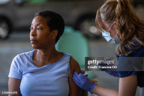 Pasadena, CA Denise Fractious of Pasadena, receives her COVID vaccine during a flu and COVID-19 vaccination clinic at Kaiser Permanente Pasadena on...