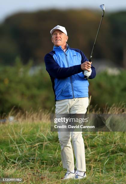 John Elway of The United States the former San Francisco 49ers quarterback plays a shot during Day Two of the Alfred Dunhill Links Championship on...