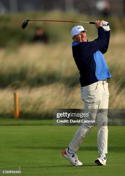 John Elway of The United States the former San Francisco 49ers quarterback plays a shot during Day Two of the Alfred Dunhill Links Championship on...