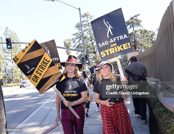 Allison Janney and Mary McCormack join the picket line outside Warner Bros. Studios on October 06, 2023 in Burbank, California. The WGA has reached a...