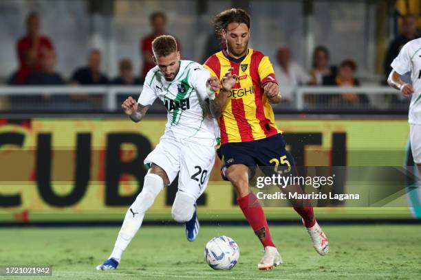 Antonino Gallo of Lecce competes for the ball with Samu Castillejo of Sassuolo during the Serie A TIM match between US Lecce and US Sassuolo at...