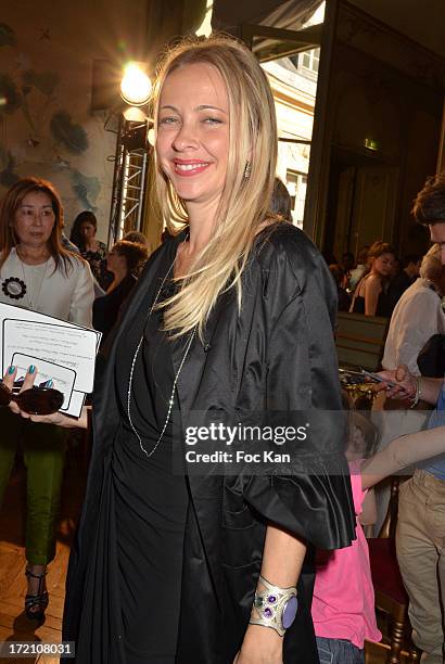 Melonie Hennessy attends the Alexis Mabille show during Paris Fashion Week Haute-Couture F/W 2013-2014 at the Hotel d' Evreux on July 1, 2013 in...