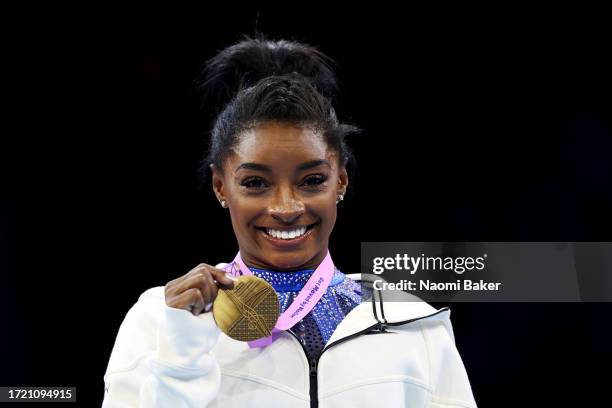 Gold medalist Simone Biles of Team United States poses for a photo during the medal ceremony for the Women's All Around Final on Day Seven of the...