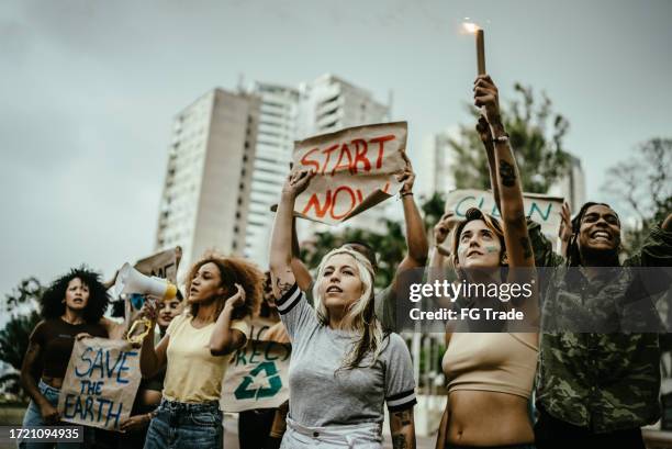 people during a protest at city street - revolutionary war stock pictures, royalty-free photos & images