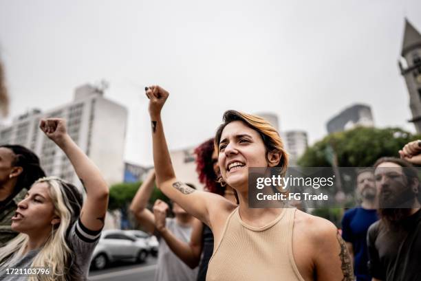 people protesting in the street - protest stock pictures, royalty-free photos & images