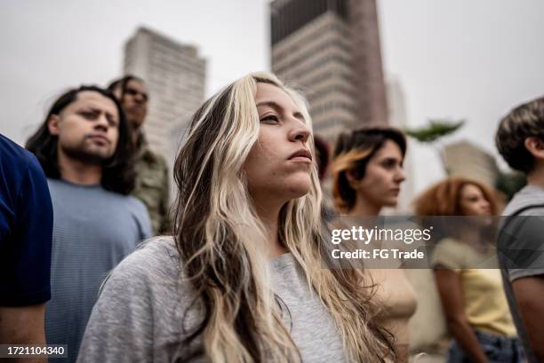 people protesting in the street - moment of silence stock pictures, royalty-free photos & images