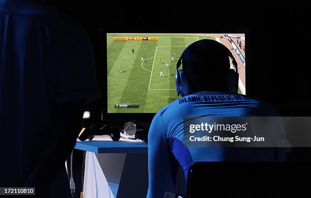 Khoie Seyed Davoud of Iran competes in the e-Sports, FIFA 13 semi final against Chen Wei of China at Samsan World Gymnasium during day four of the...