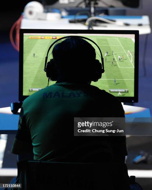 Chew Hoe Sheng of Malaysia competes in the e-Sports, FIFA 13 semi final against Saprikin Pavel of Uzbekistan at Samsan World Gymnasium during day...