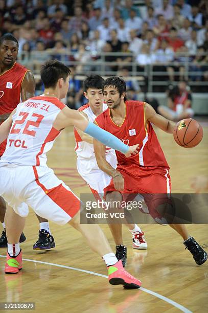 Ricky Rubio of Minnesota Timberwolves drives the ball during the 2013 Yao Foundation Charity Game between China and the NBA Stars at MasterCard...
