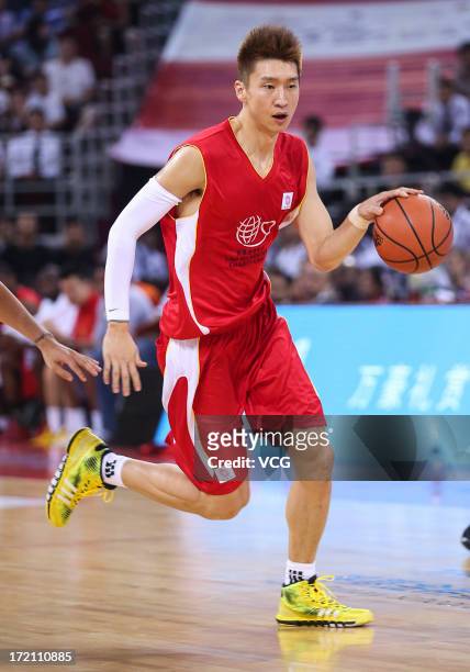 Sun Yue of China drives the ball during the 2013 Yao Foundation Charity Game between China and the NBA Stars at MasterCard Center on July 1, 2013 in...