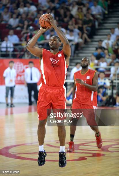 Metta World Peace of Los Angeles Lakers shoots the ball during the 2013 Yao Foundation Charity Game between China and the NBA Stars at MasterCard...