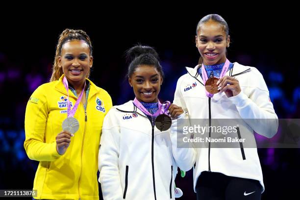 Silver medalist Rebeca Andrade of Team Brazil, gold medalist Simone Biles of Team United States and bronze medalist Shilese Jones of Team United...