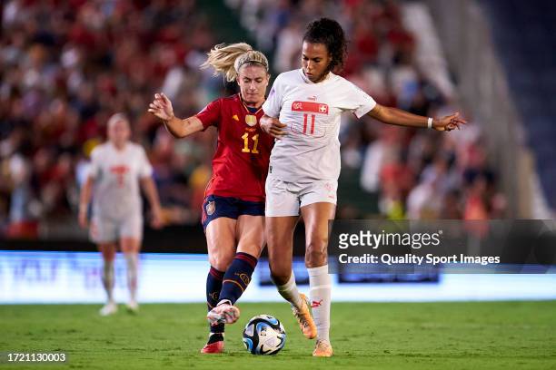Alexia Putellas of Spain competes for the ball with Coumba Sow of Switzerland during the UEFA Womens Nations League match between Spain and...