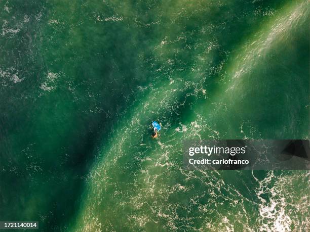wave rider - body board - chandler park beach - cocoa beach - florida beach - cape canaveral - top down - high angle - tide stock pictures, royalty-free photos & images