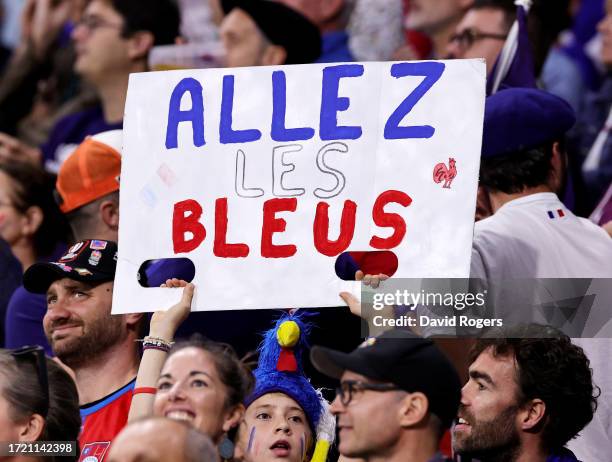 Young Fan of France holds up a sign which reads "Allez Les Bleus" during the Rugby World Cup France 2023 match between France and Italy at Parc...